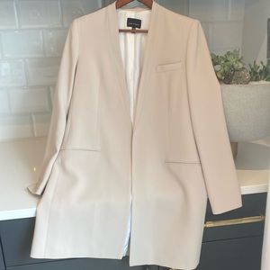 Beautifully made cream blazer like new worn once and dry cleaned